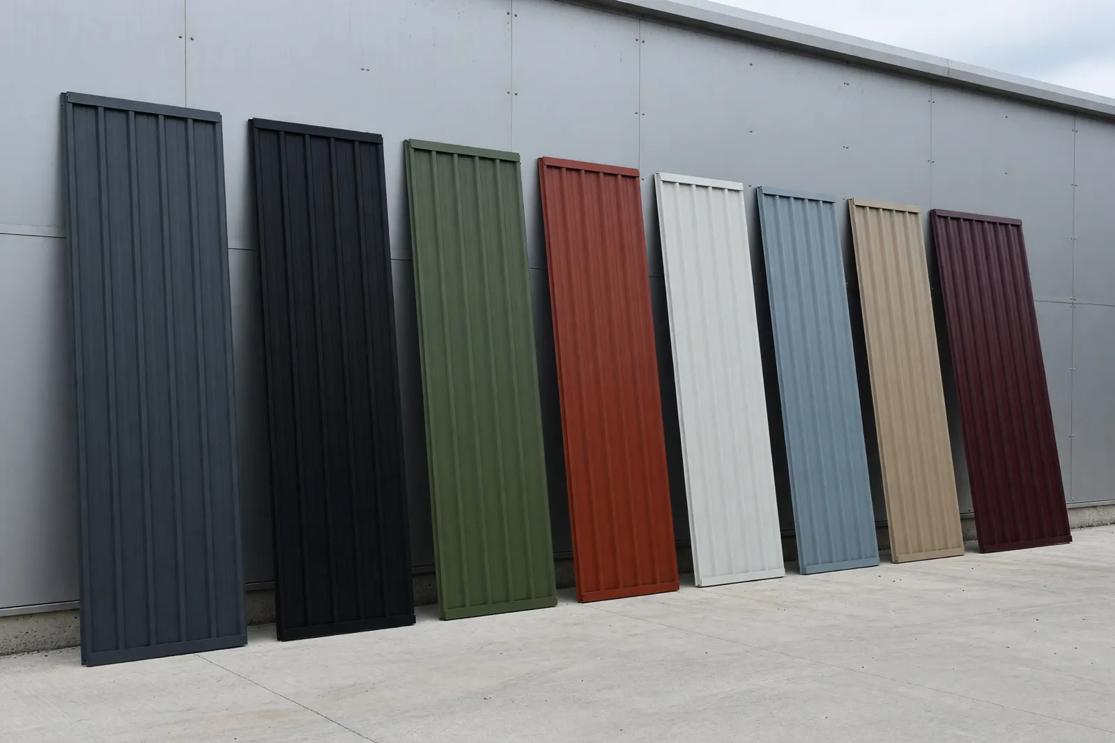 Concept visualisation, not a photograph: the colour yard in corrugated powder-coated steel.