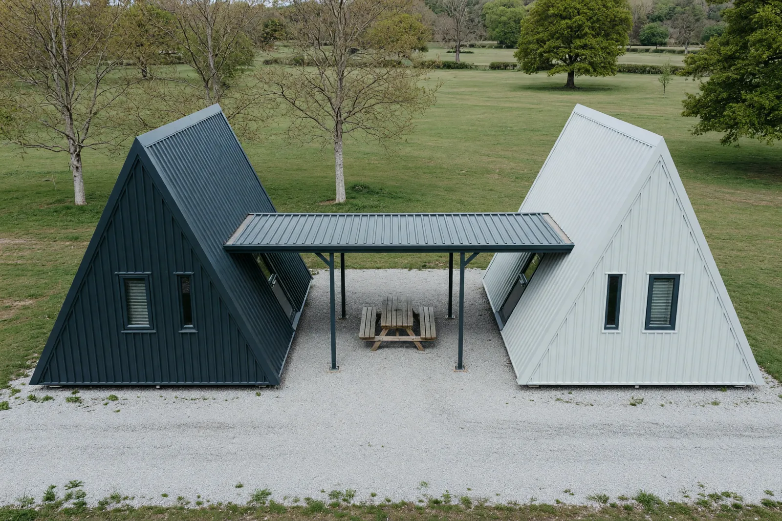 Concept visualisation, not a photograph: linked duplex in corrugated powder-coated steel.